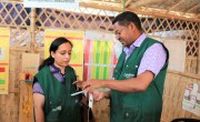 Nutrition Advisor Dawit Hagos showing the nutrition measurement procedure to System Director Hasina Rahman. Photo; Concern Worldwide