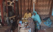 Ramatou Jean Coffi , Community Outreach Agent for Concern with her husband Mahamadou Thiwouaké and her daughter Narna Ferdossi. Pictured at home in Tahoua City. Photo: Ollivier Girard / Concern Worldwide