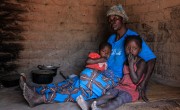 Caustasie and her granchildren sitting on floor in DRC