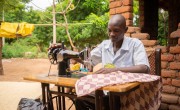 Man working on sewing machine
