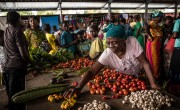 A woman displays her vegetables for sale at a central market in DRC