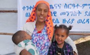 Amint Mohammed Yesuf (26) holding her son Nebil Yimam Kassau (18 months) and her daughter Mieraj Yimam (3) in Abasokotu mobile health clinic