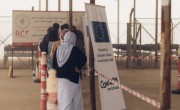 People receive hygiene kits at Khanke IDP site in Duhok. The kits contain shampoo, soap, detergent, nappies and pads for women. (Photo: George Henton/Concern Worldwide)