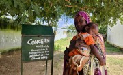 Dahabeeja Hamad holding her son at Concern camp 