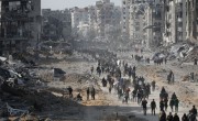 Displaced Palestinians start to return their houses past damaged buildings