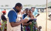 Concern's Salomon Kalembu with beneficiaries