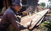 Nura Naryan Shristha, 52, works to recover building materials from his home in Bakrang, near the epicenter of the earthquake. Photo: Crystal Wells/Concern Worldwide