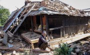 Nura Naryan Shristha, 52, works to recover building materials from his home in Bakrang, near the epicenter of the earthquake. Photo: Crystal Wells/Concern Worldwide