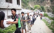 Supplies are unloaded at a Rural Reconstruction Nepal (RRN) and Concern Worldwide team distribution in Talamarang.