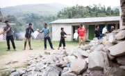 Supplies are unloaded at a Rural Reconstruction Nepal (RRN) and Concern Worldwide team distribution in Talamarang (VDC), Sindhupalchok district. Photo: Crystal Wells/Concern Worldwide