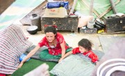 Chameli Darji, 35, and her youngest daughter, Apita, six, arrange the items they received at Concern Worldwide and Rural Reconstruction Nepal (RRN). Photo: Crystal Wells/Concern Worldwide