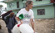 Concern Worldwide staffer Regine Kopplow helps people through a distribution on May 16, 2015 in Bhirkot, a village in Dolakha district, Nepal. (Photo: Crystal Wells/Concern Worldwide)