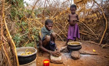 A family in Kenya prepare wild fruits for a meal.