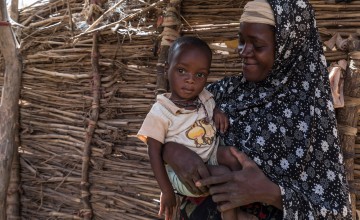 Rouaya with her son Salouhou at their home. Salouhou has just been admitted into Concern’s nutrition programme and has started treatment for Severe Acute Malnutrition. Photo: Apsatou Bagaya / Concern Worldwide.