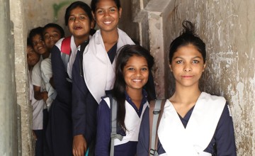 Programme participants of the Amrao Manush (we are people too) programme leaving the centre where they slept the night to walk to school in Dhaka, Bangladesh. All of these girls were pavement dwellers before joining the Amrao Manush programme supported by Concern Worldwide. Photo: Jennifer Nolan.