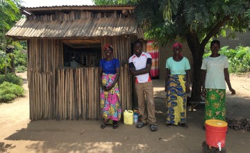 Graduation beneficiaries in front of the shop they have set up under the project; they have taken the initiative to establish a hand-washing station in front of the shop and they report soap sales have increased in the last few days as communities have been sensitised on the importance of hand-washing to prevent COVID transmission. Burundi Photo: Maud Biton / Concern Worldwide