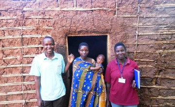 From left, Libère Karenzo, Monitoring and Evaluation Officer with programme participant, Claudine Rwasa and her Case Manager Marie Rose during monthly household visits, Busoni Commune, Kirundo Province, Burundi. December 2013. Photo: Edward O’Carroll / Concern Worldwide.