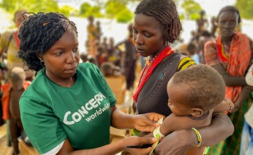 Hella has brought Nyanga to a Concern outreach clinic so that he can receive the supplements that will treat his severe malnutrition.