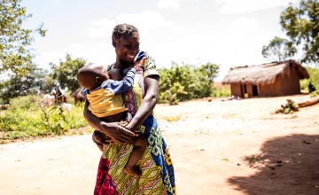 Image of Natalie Ngoyi at home with her 1 year old baby, Adere.