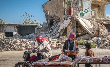 Inhabitants of Idlib, Syria, with pide, a traditional round and flat bread, during the holy month of Ramadan. Anadolu Agency via AFP/Muhammed Said 2021