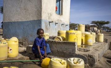 Women and children collect water from a water point in Horrigutha, near by North Horr town in Marasbit on 21/12/21. Photo: Ed Ram / Concern Worldwide.