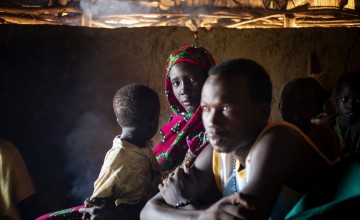 Young South Sudanese couple and one of their children