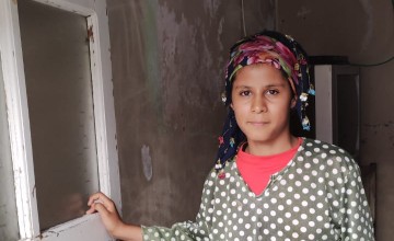 Eslem at the door to her home in Turkey