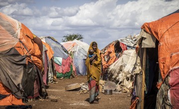 Samiro is pictured with her grandchild Calaso at an IDP settlement where she is receiving water and being supported by Concern with an emergency cash programme. Photo: Ed Ram