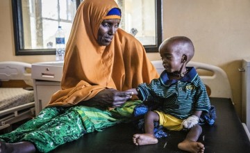 Halima (50) and her grandson Aaden (3) in Banadir Maternity & Children Hospital, Mogadishu, Somalia. Aaden’s mother is dead and Halima brought him from their home 120km outside the city where all 40 of their cattle have died and only a few goats and camels remain. Photo: Ed Ram/Concern Worldwide