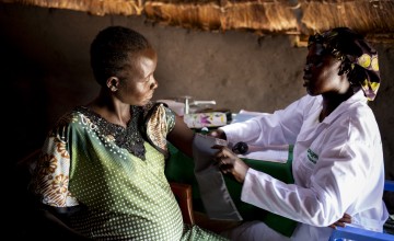 A South Sudanese woman is examined by a midwife in her ninth month of pregnancy