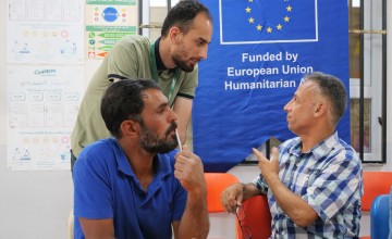 Committee member Azzam* (right) participates in an information session as part of the Protection programme at Haliliye Community Centre. Photo: Eugene Ikua/Concern Worldwide