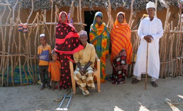 Mohammed, who lost his leg in a crocodile attack, with his wife and five children in Handaraku, Tana River Country, Kenya. Photo: Eugene Ikua/Concern Worldwide