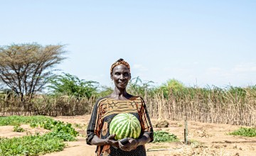 Ruth Epat Koli, a farmer in Turkana, holding a watermelon