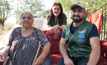 Concern staff sitting on red couch with Meryem Kaya in Malatya
