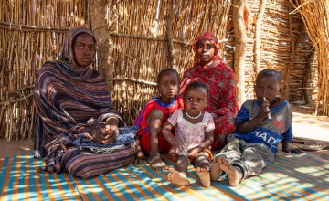 Didja, her sister and her children in a refugee camp in Chad 