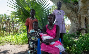 Maria with her family. In her arms is her son Goi (2). On the far left is her daughter Nyatuoch (7). Second from left is her son Teny (4). On the far right is Angelina’s sister Chol (12). Photo: Eugene Ikua/Concern Worldwide