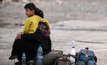 A boy and his mother after leaving Lebanon