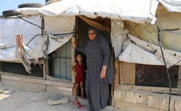 Assia stands outside her family's shelter in Lebanon. Photo: Omar Daouk/Concern Worldwide