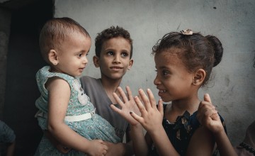 Rima plays with children in her neighbourhood