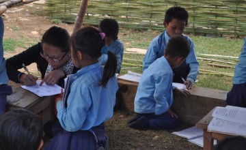 Dumsijhang lower secondary school was destroyed by the Nepal earthquake. While children have lessons in makeshift shelters, Concern works to rehabilitate schools as part of BREAC. Photo: Deborah Underdown/Concern Worldwide