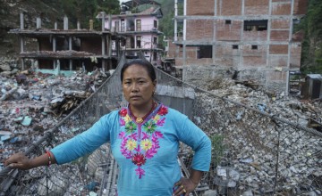 Sua Tamang overlooks the devastation caused by the second earthquake in Dolakha District. (Photo: Brian Sokol/Panos Pictures/Concern Worldwide)