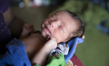 Day-old daughter, Noor Kayda*, in her shelter at Moynardhona refugee camp, Cox's Bazar, Bangladesh. Photo: Kieran McConville/Concern Worldwide.
