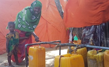 Maryam fetching water near her house within the camp. Photo: Ifrah Abdi Hussein / Concern Worldwide