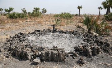 The burnt out remains of the home of a staff member of Nile Hope, a South Sudanese NGO working with Concern Worldwide in Unity State. Photo: Kieran McConville / Concern Worldwide
