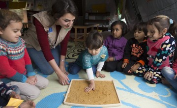 Concern Worldwide education officer, Nour Al Hajal, with a group of children attending a non-formal education programme that focuses on early childhood education in northern Lebanon. Photo: Chantale Fahmi/Concern Worldwide 2017.  &nbsp;