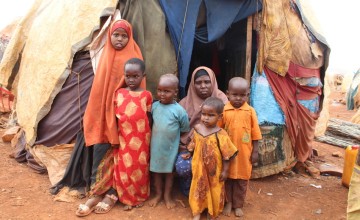 Khadra* with five of her seven children outside their makeshift house in an IDP camp in Somalia. Photo: Alinur Ali Mohamed/ Concern Worldwide
