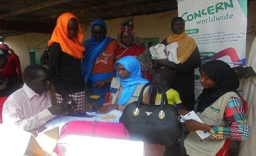 Boll with Concern emergency response team in Meyriam County distributing kits to meet basic needs. Photo: Concern Worldwide.