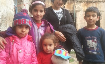 Souad and her four children outside their rented accommodation. Souad’s three school-aged children missed three years of schooling in Turkey, before accessing a Concern-supported government school. Photo: Concern Worldwide. 