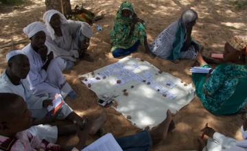 Men and women make up the Tcharow Comite Communautaire d’Action (Community Action Committee) in Tcharow, Goz Beida, Sila Region, Chad. Photo: Dom Hunt / Chad / 2014
