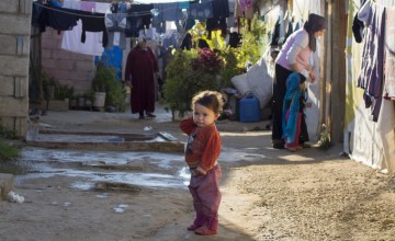 A Syrian child living in an informal settlement near the city of Halba in Northern Lebanon. Photo taken by Kieran McConville / Concern Worldwide.
